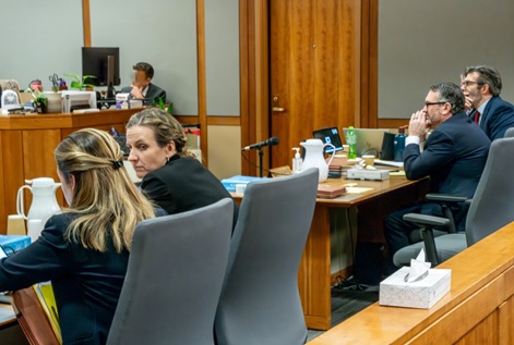 In the courtroom during trial, Co-Counsel Krystyn Tendy is seated with the Office of Special Prosecutions, Anchorage District Attorney Brittany Dunlop, and at the defense table defendant Anthony Michael Pisano is seated with defense attorney Michael Branson.