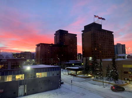 A stunning sunrise backdropping the buildings of downtown Anchorage as seen from the Department of Law offices