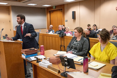 Left to Right: Patrick McKay Jr., Emily Cooper—defense attorney, 24-year-old defendant Denali Brehmer.  Co-counsel for the State, Whitney-Marie Bostick, is partially visible, seated far left. Photo: Alaska Department of Law—Patty Sullivan.