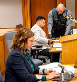 Anchorage Assistant District Attorney Ashley McGraw pictured in the foreground after the sentencing. Michael Jolly in the background is giving his fingerprints to the Judicial Services Officer.