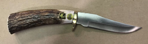 knife with with a Made in Alaska sticker affixed to the handle